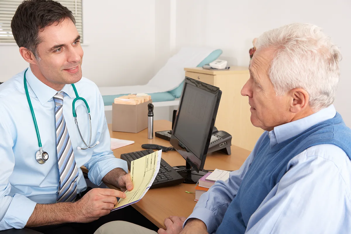 general practitioner speaking to a patient